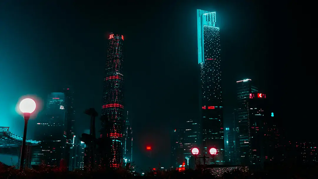 A nighttime cityscape with colorful light orbs
